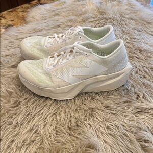 New Balance Fuel Cell women’s tennis shoes. Mesh cream color size 9.5US.